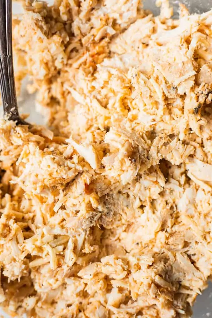 Creamy chicken mixture seasoned and ready for making taquitos.