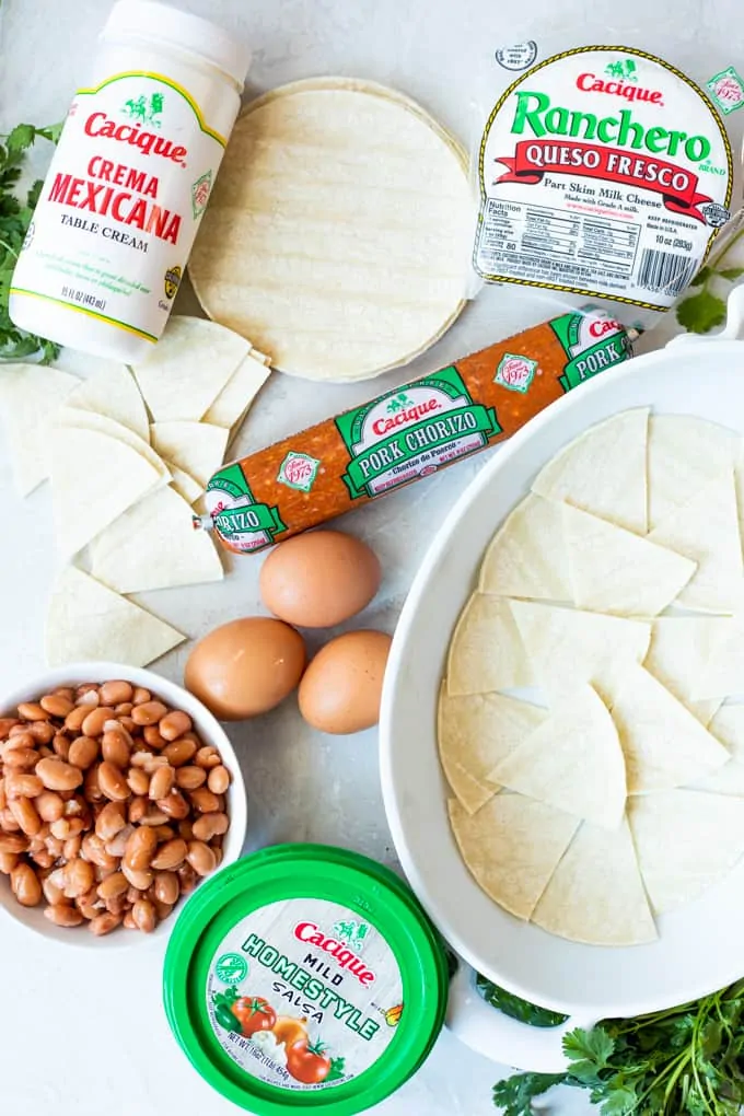 Overhead view of the ingredients needed to make a homemade huevos rancheros breakfast casserole.
