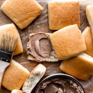 Texas Roadhouse Rolls topped with a swirl of cinnamon Honey butter.