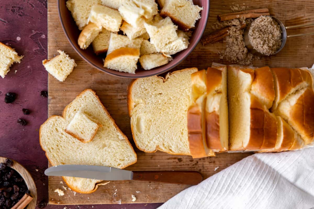 Slicing bread for bread pudding.