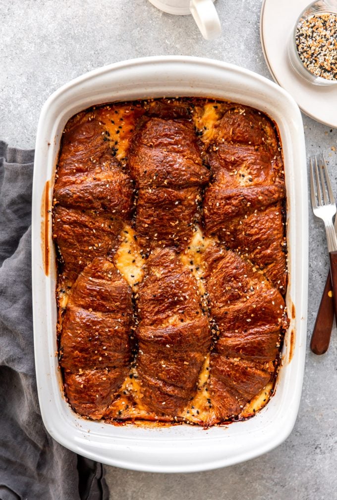 Baking dish with ham and cheese croissant breakfast casserole. 