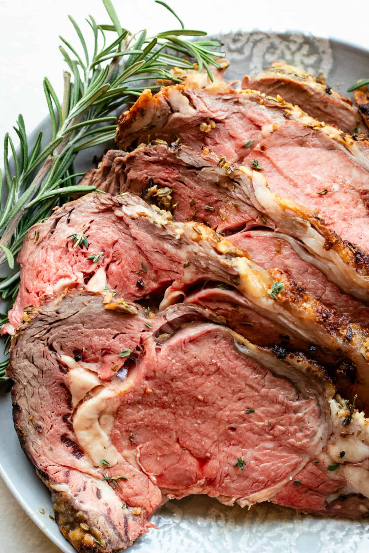 Plate with sliced prime rib ready to be served.