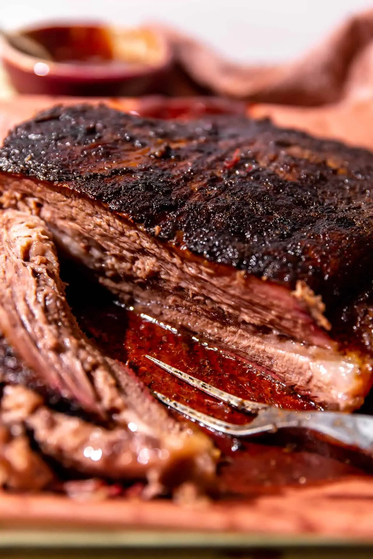Sliced beef brisket after smoking with juices coming out.
