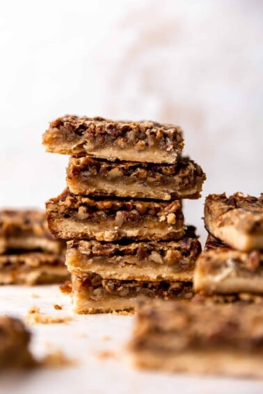 Stack of homemade pecan pie bars.