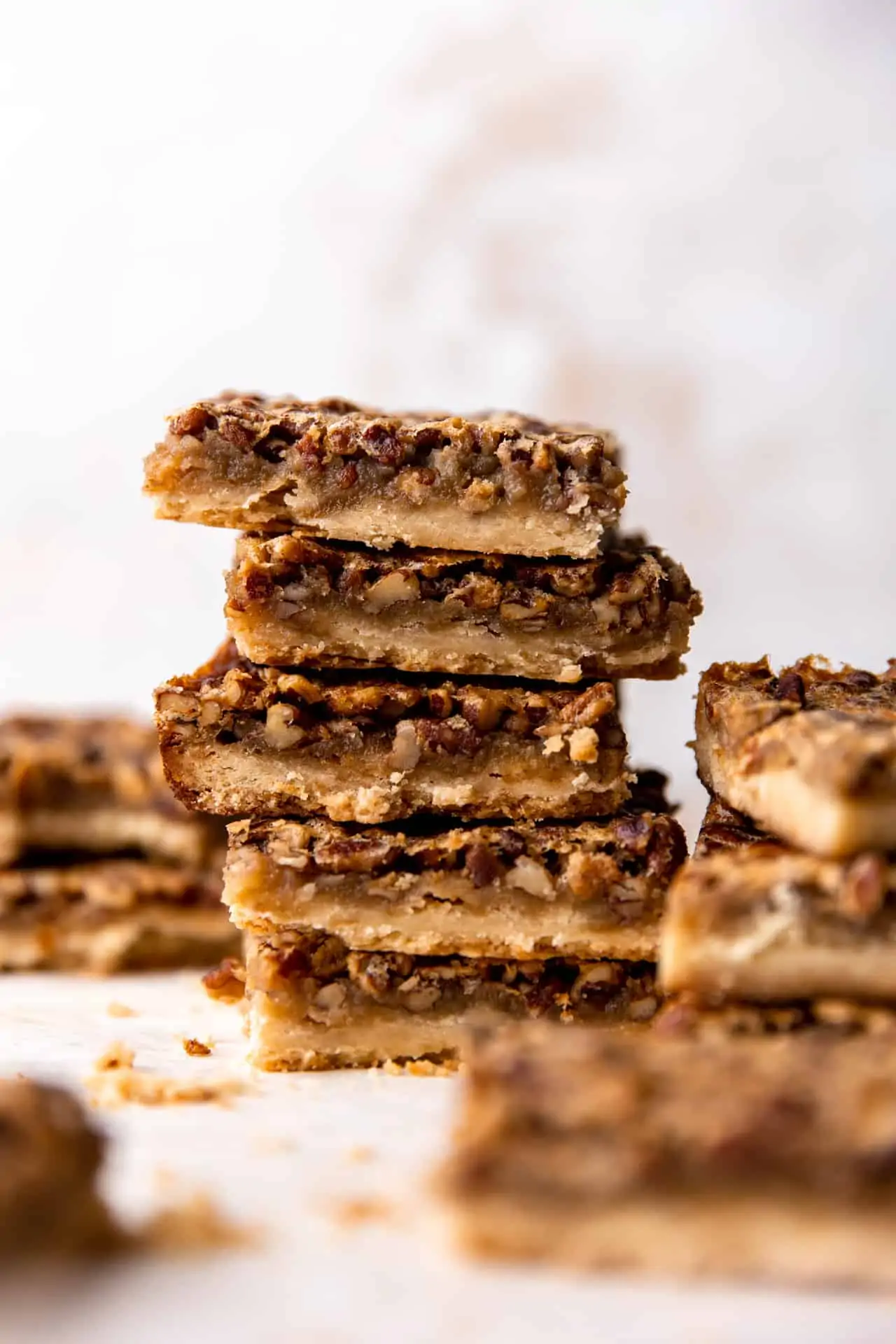 Stack of homemade pecan pie bars.