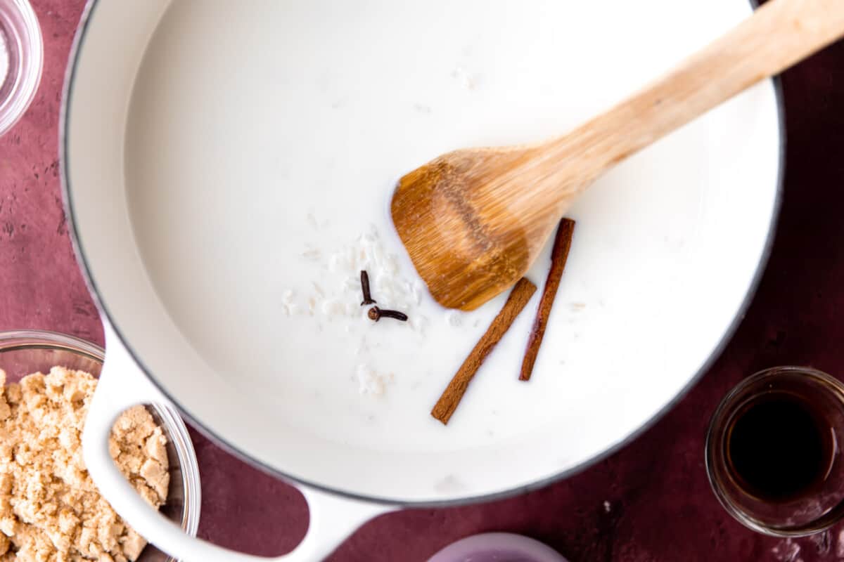 Milk, cinnamon, and cloves added to cooked rice for making pudding.