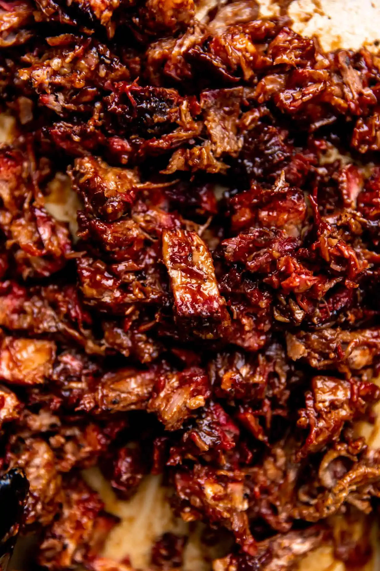 Smoked beef chopped and coated with sauce for making sandwiches. 