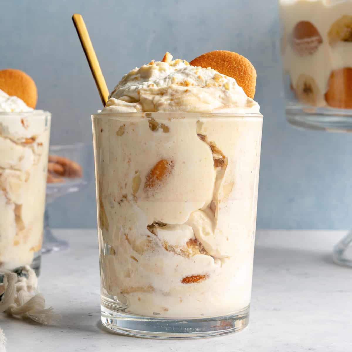 Banana pudding served in a cup with a spoon.