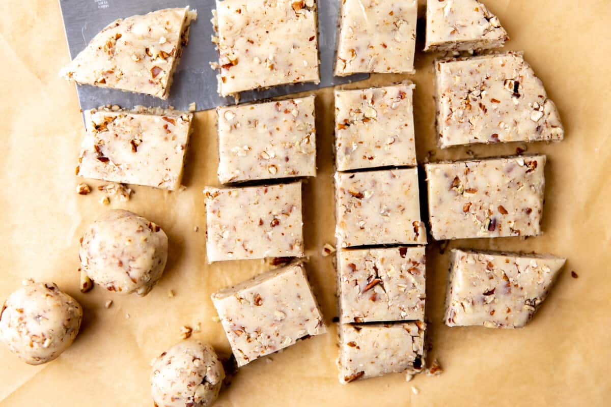 Mexican wedding cookie dough divided into sections to roll.