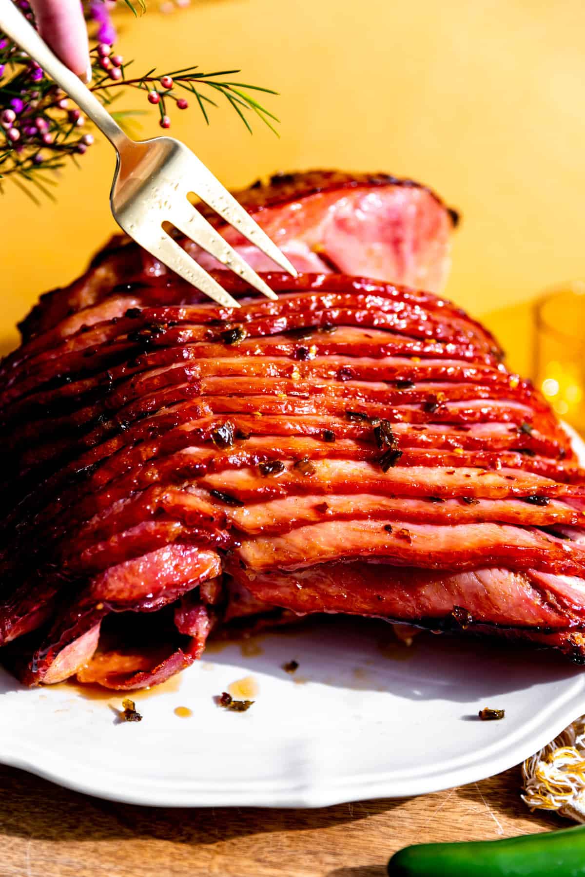Up close view of cooked jalapeno honey ham with bits of jalapeno on it.