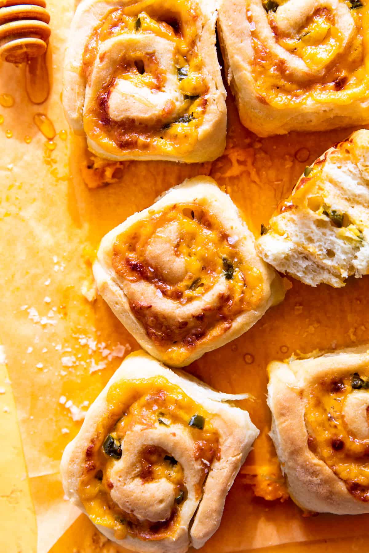 Jalapeno Cheese Rolls drizzled with honey and sprinkled with salt flakes.