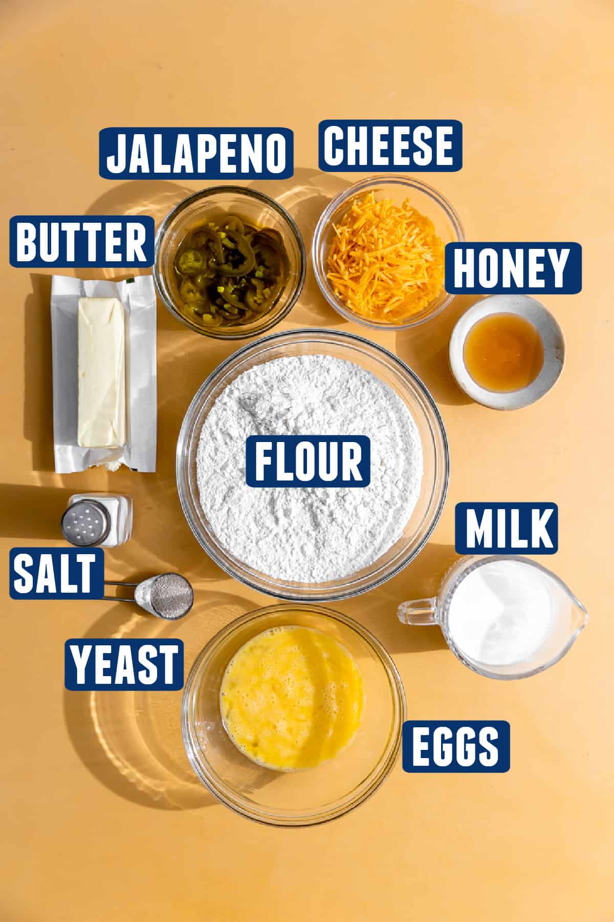 Ingredients needed to make jalapeno cheese rolls laid out on the counter.
