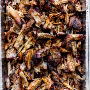 Tin filled with shredded smoked pork carnitas.