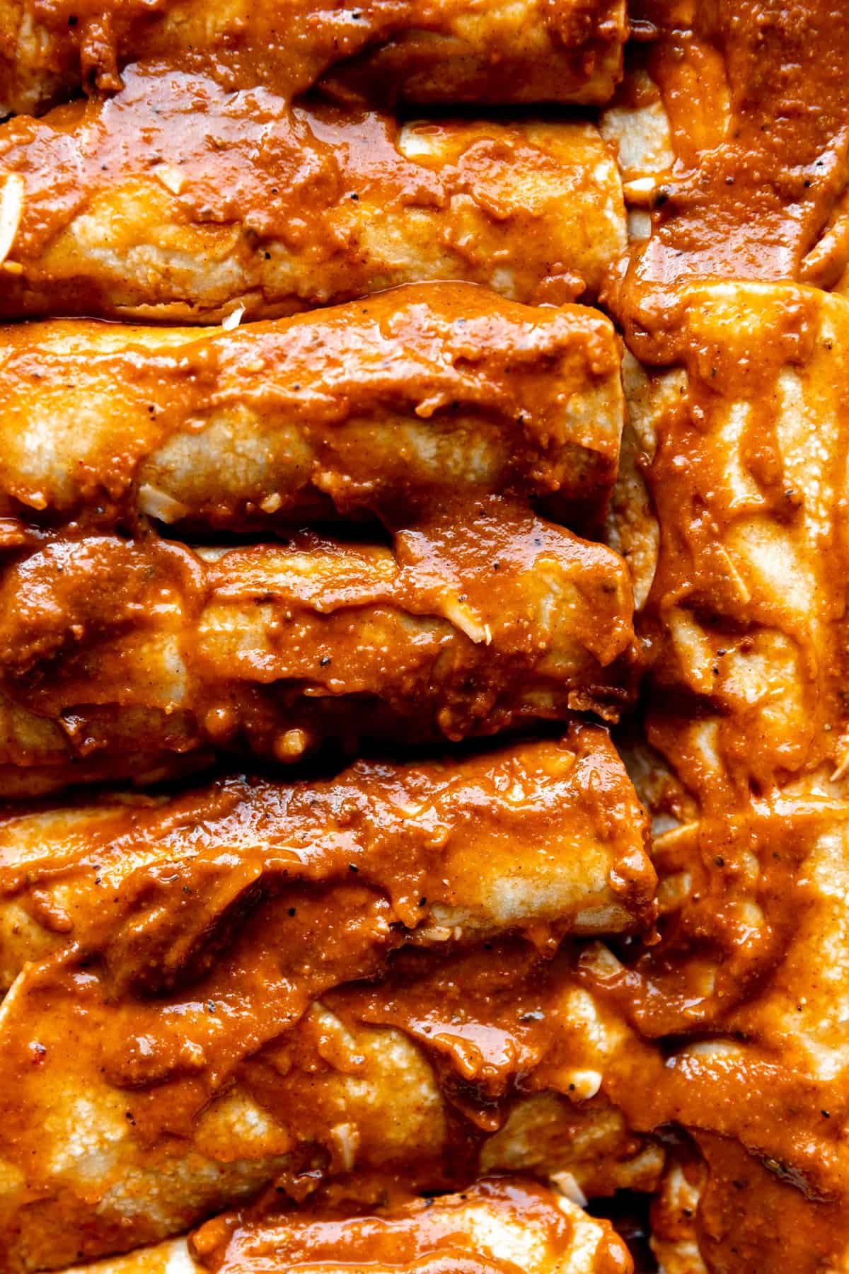Corn tortillas rolled with cheese inside and smothered in a Texas Chili Gravy sauce for enchiladas. 