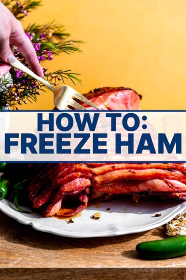 Ham served on a platter with a fork spreading slices apart, text in front saying How to: Freeze Ham.