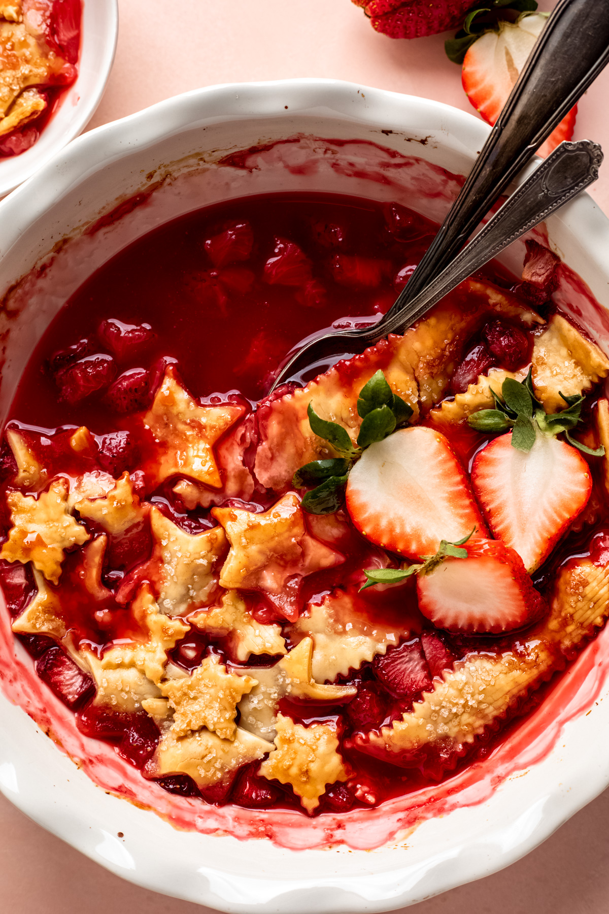 Strawberry cobbler baked with golden pie crust on top.