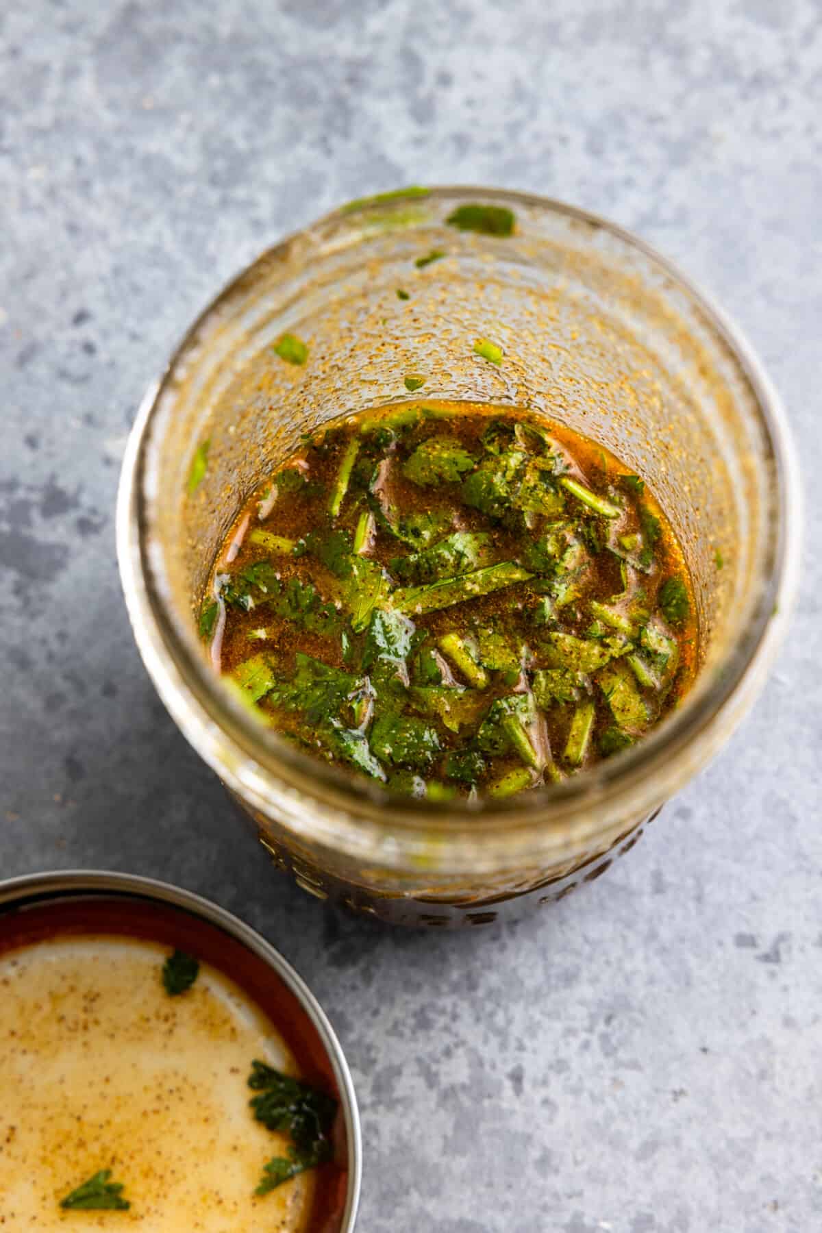 Chicken marinade mixed together in a glass jar.