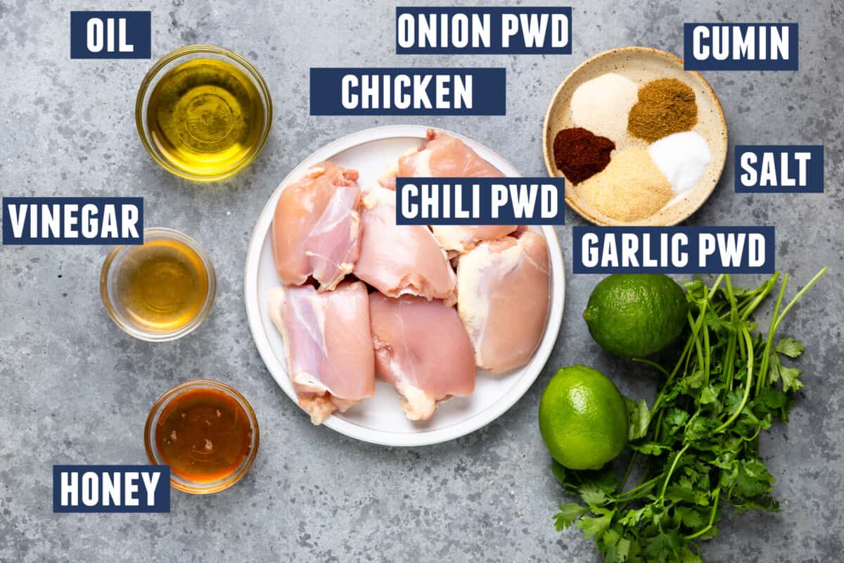 Ingredients needed for marinating chicken thighs before grilling.