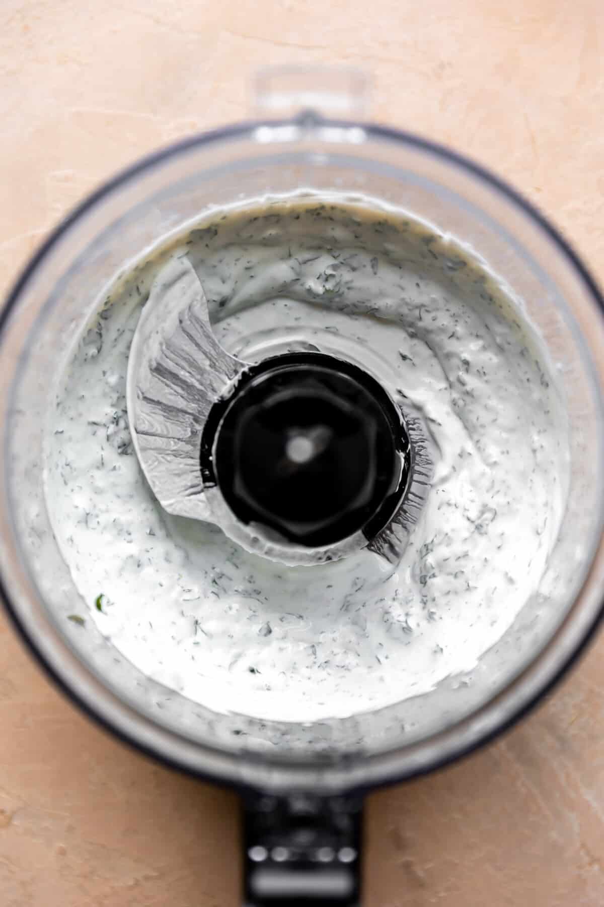Blended cilantro lime cream in a food processor. 