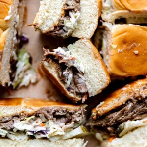 Pulled pork with bbq sauce, coleslaw and pickles on Hawaiian rolls.