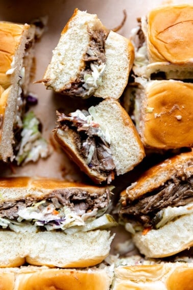 Pulled pork with bbq sauce, coleslaw and pickles on Hawaiian rolls.