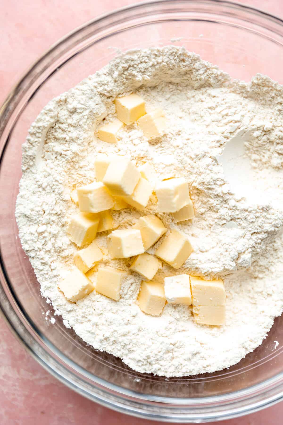 Cubed butter in a bowl of flour.