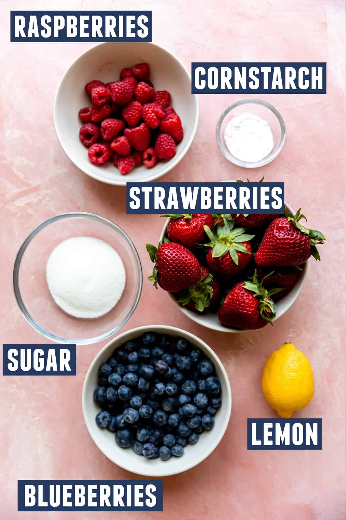 Ingredients needed to make a mixed berry cobbler filling laid out on the counter. 