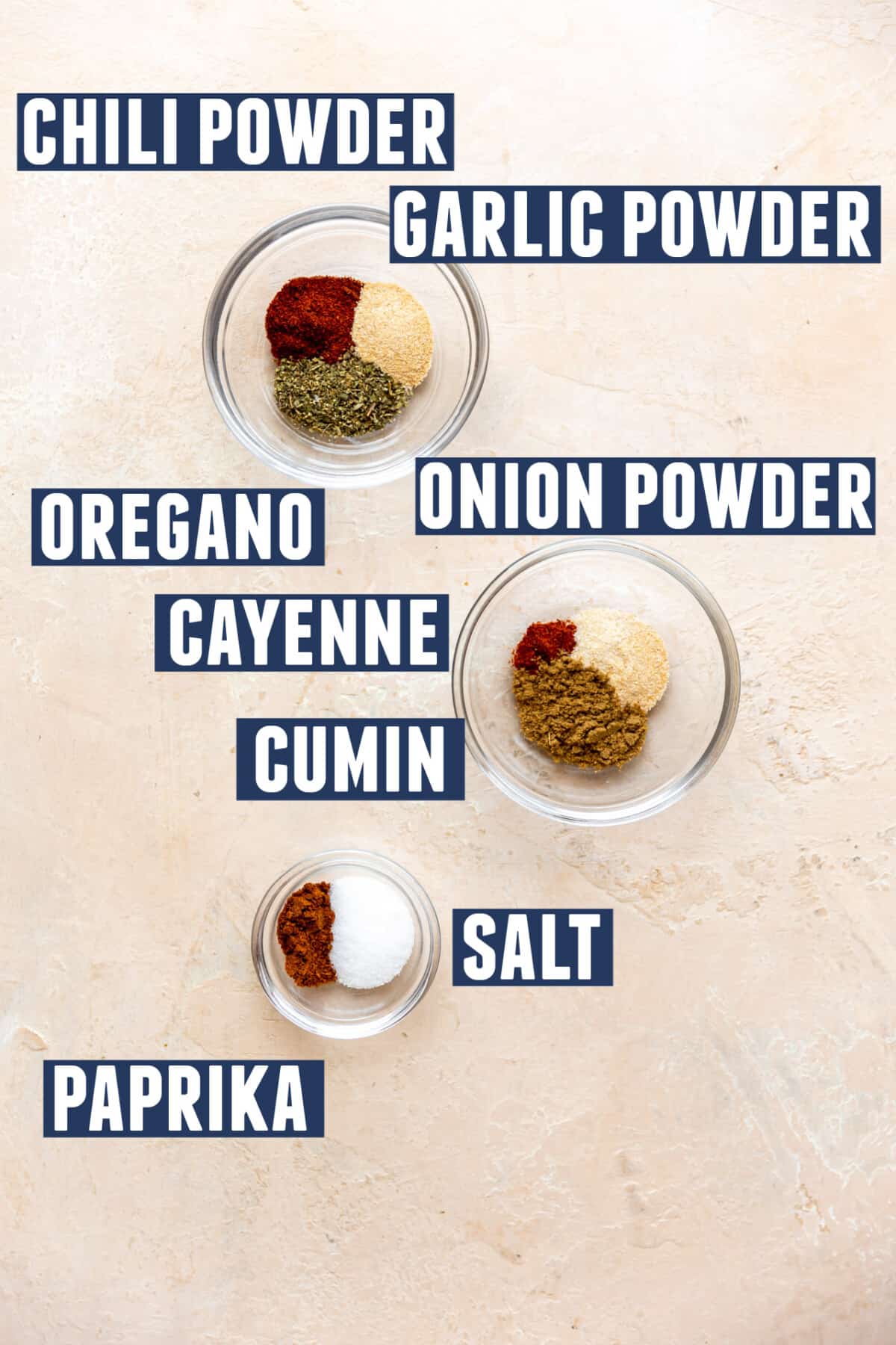 Spices needed to make a homemade fajita vegetable seasoning laid out on the counter. 