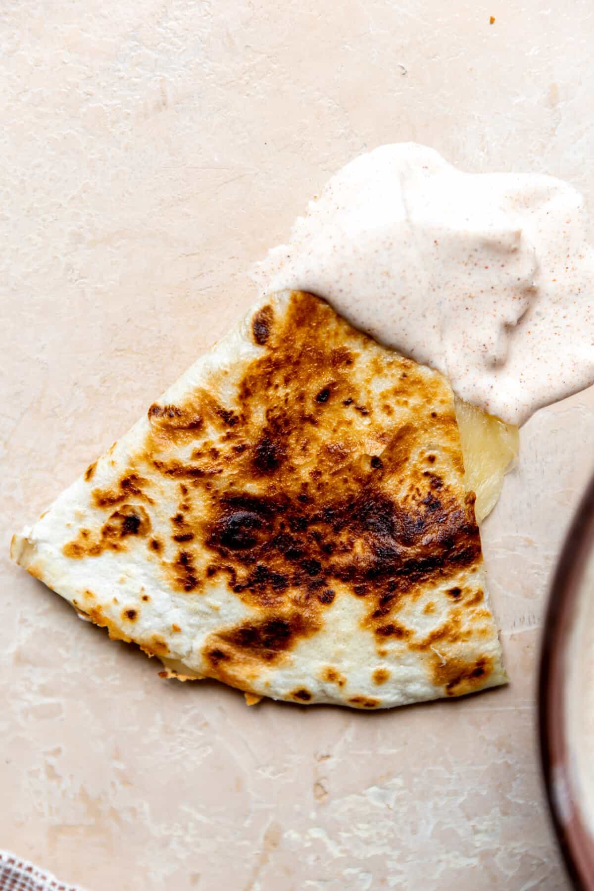 Cheese quesadilla dipped in creamy jalapeño Taco Bell quesadilla sauce. 