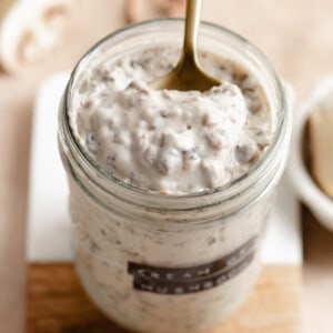 Jar of cream of mushroom soup with a spoon.