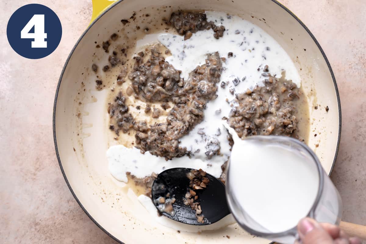 Cream being added to a skillet for homemade cream of mushroom soup.