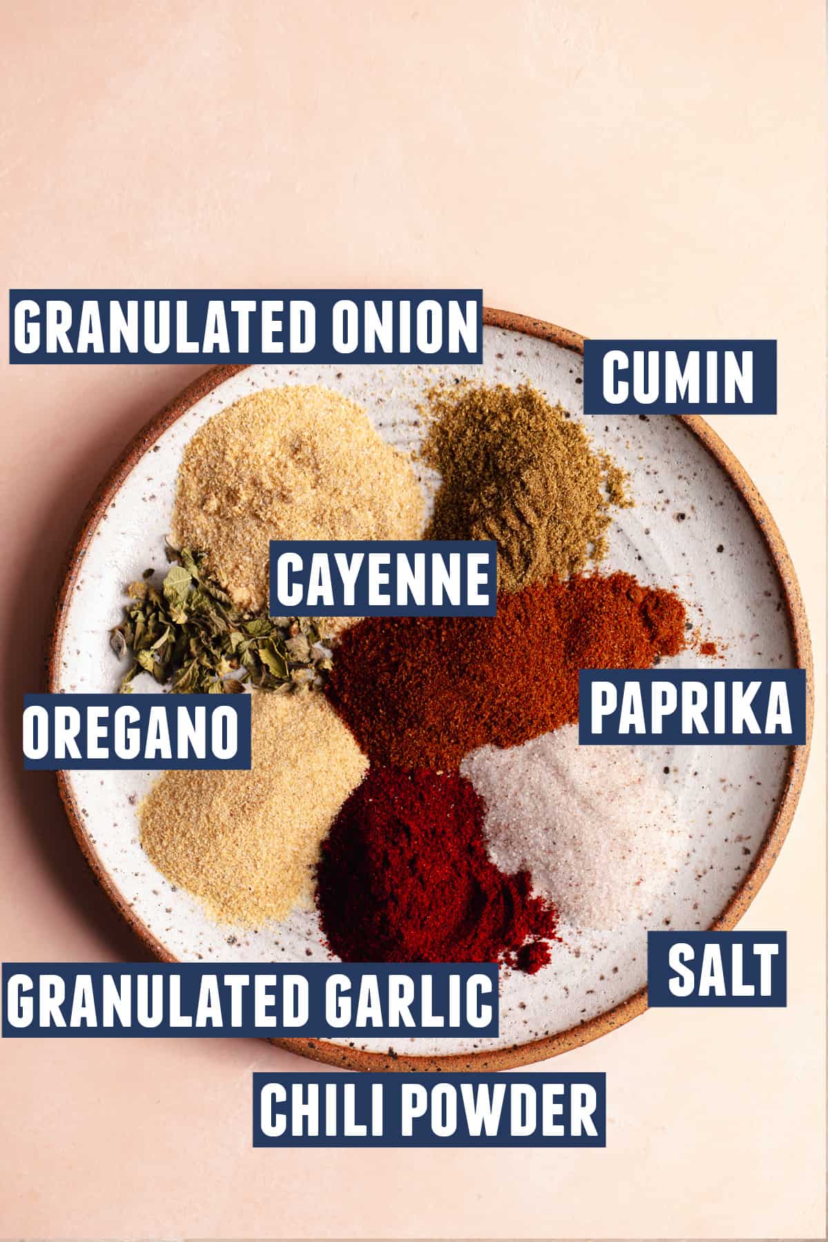 Plate with all the spices needed to make a homemade fajita seasoning.