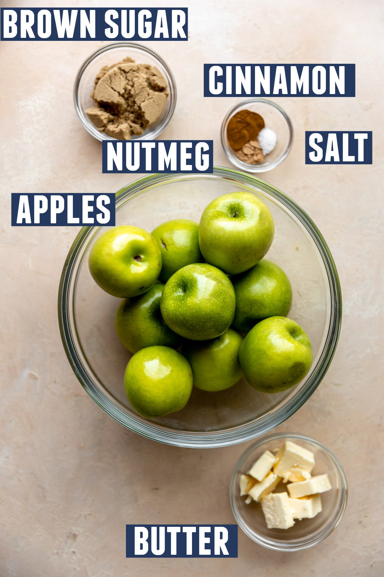Ingredients needed to make fried apples laid out on the counter. 