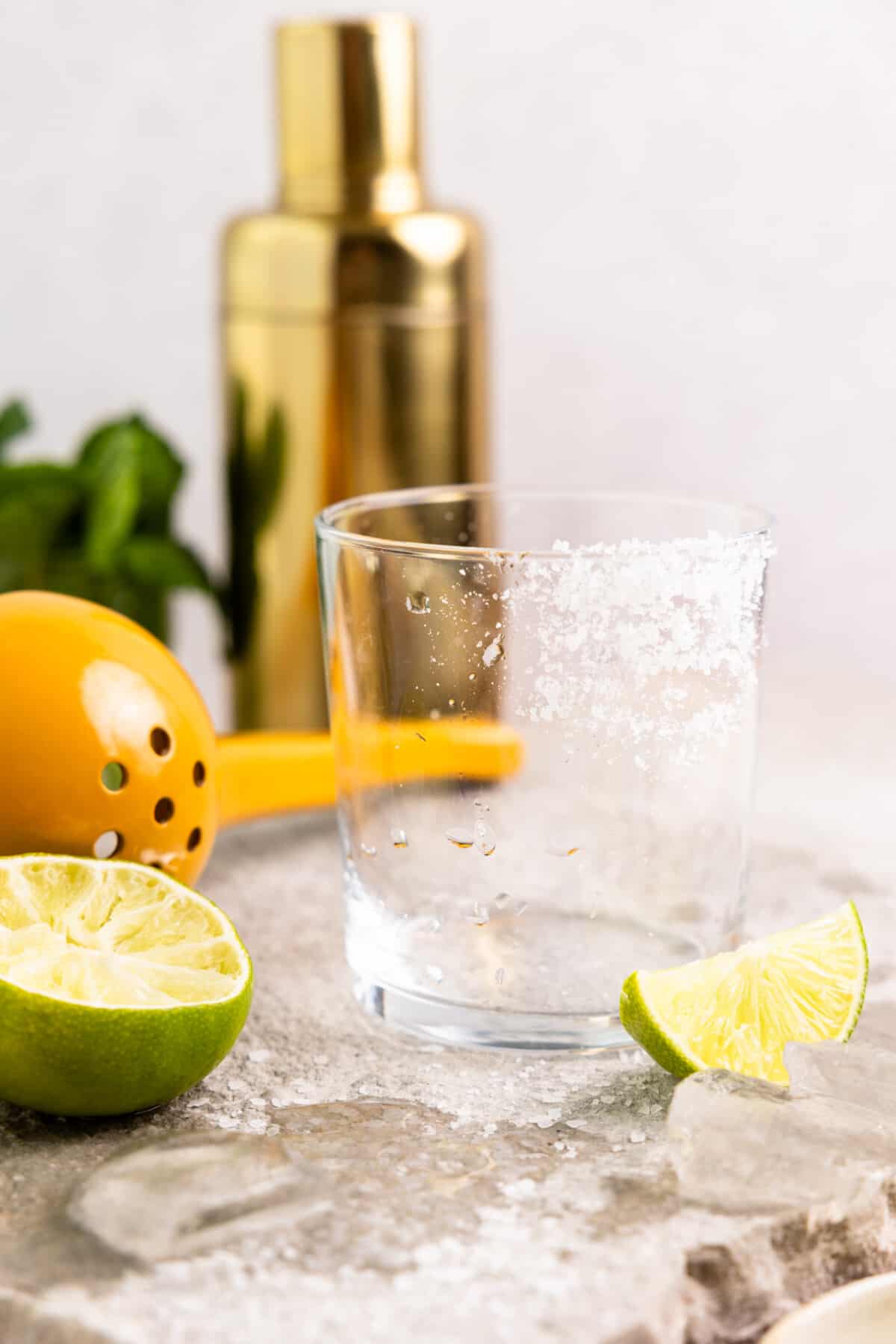 Prepping a glass with salt on the rim for a margarita.