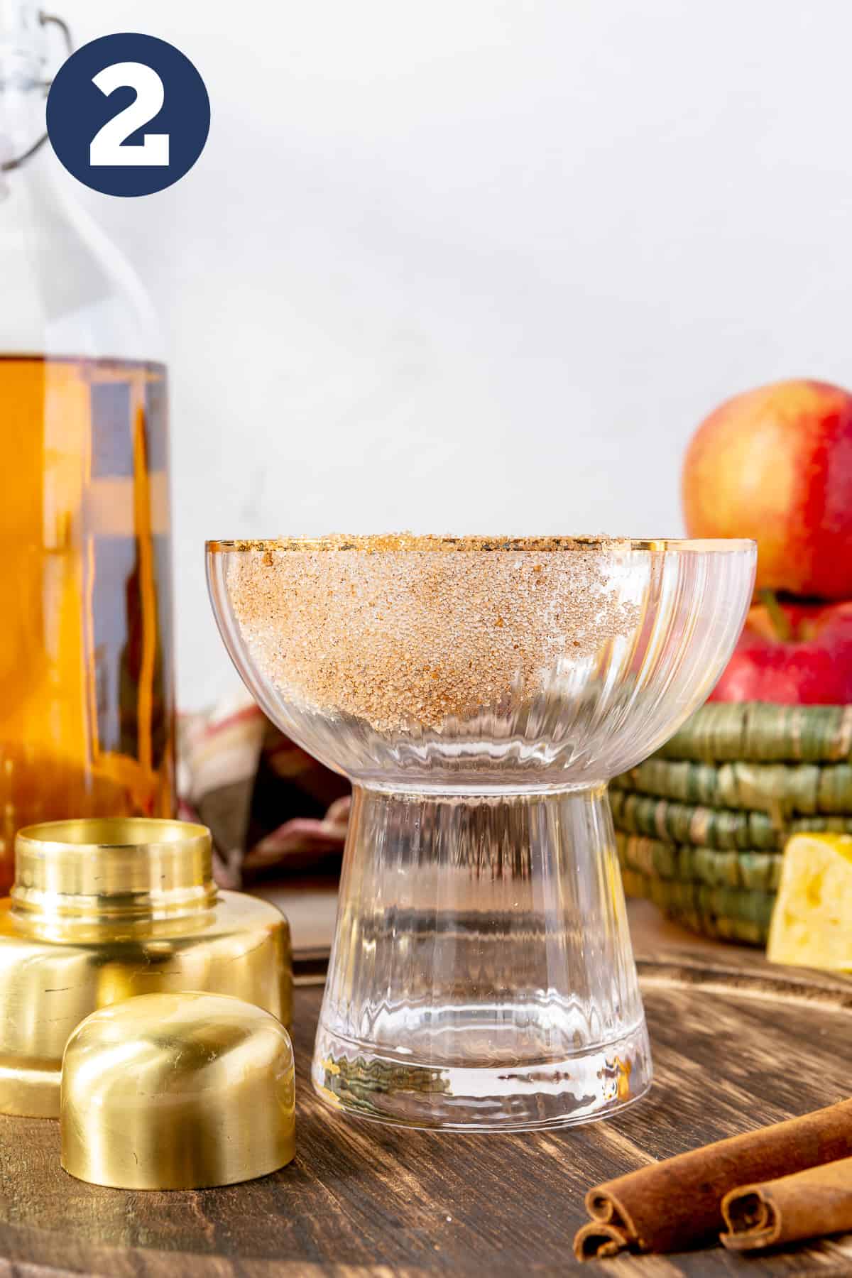 Stemless margarita glass with cinnamon sugar on the rim. 