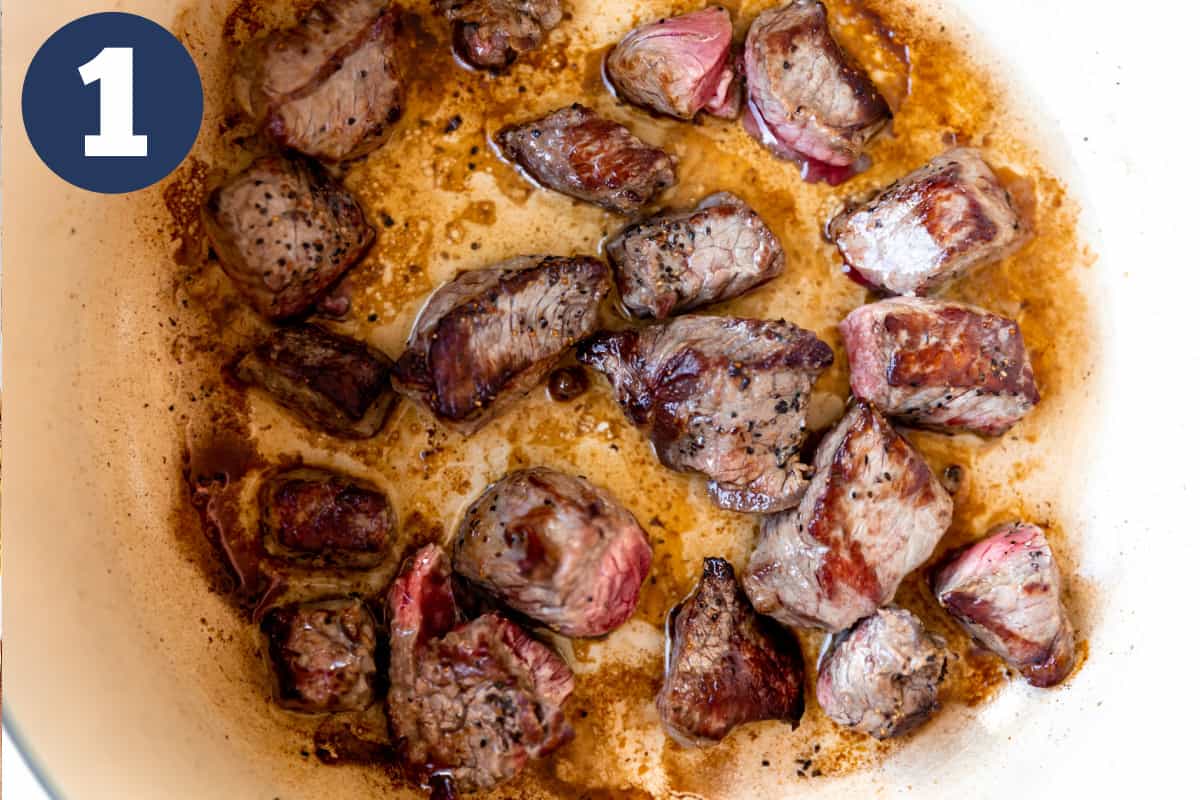 Searing stew meat in a dutch oven. 