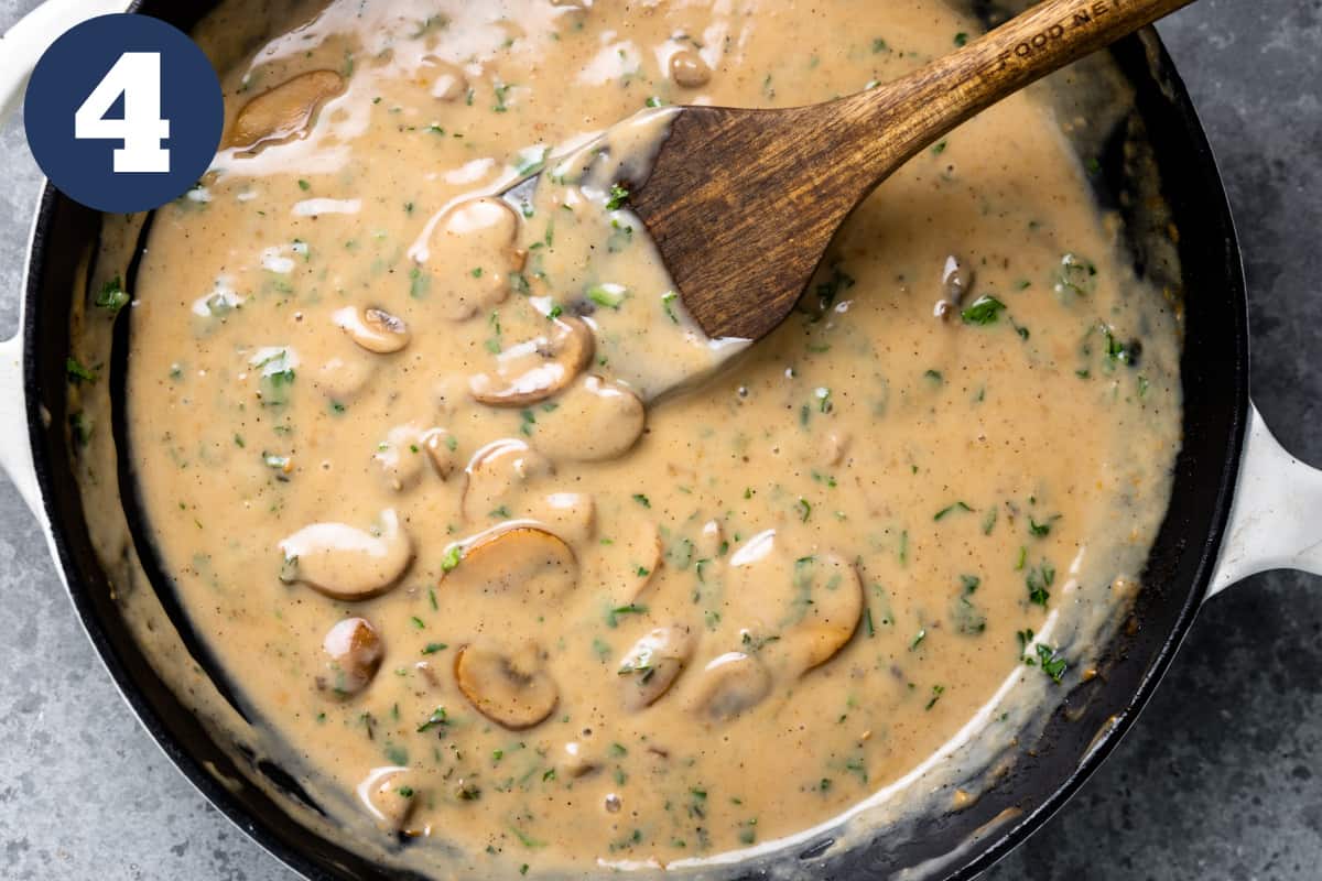 Skillet with creamy mushroom sauce.