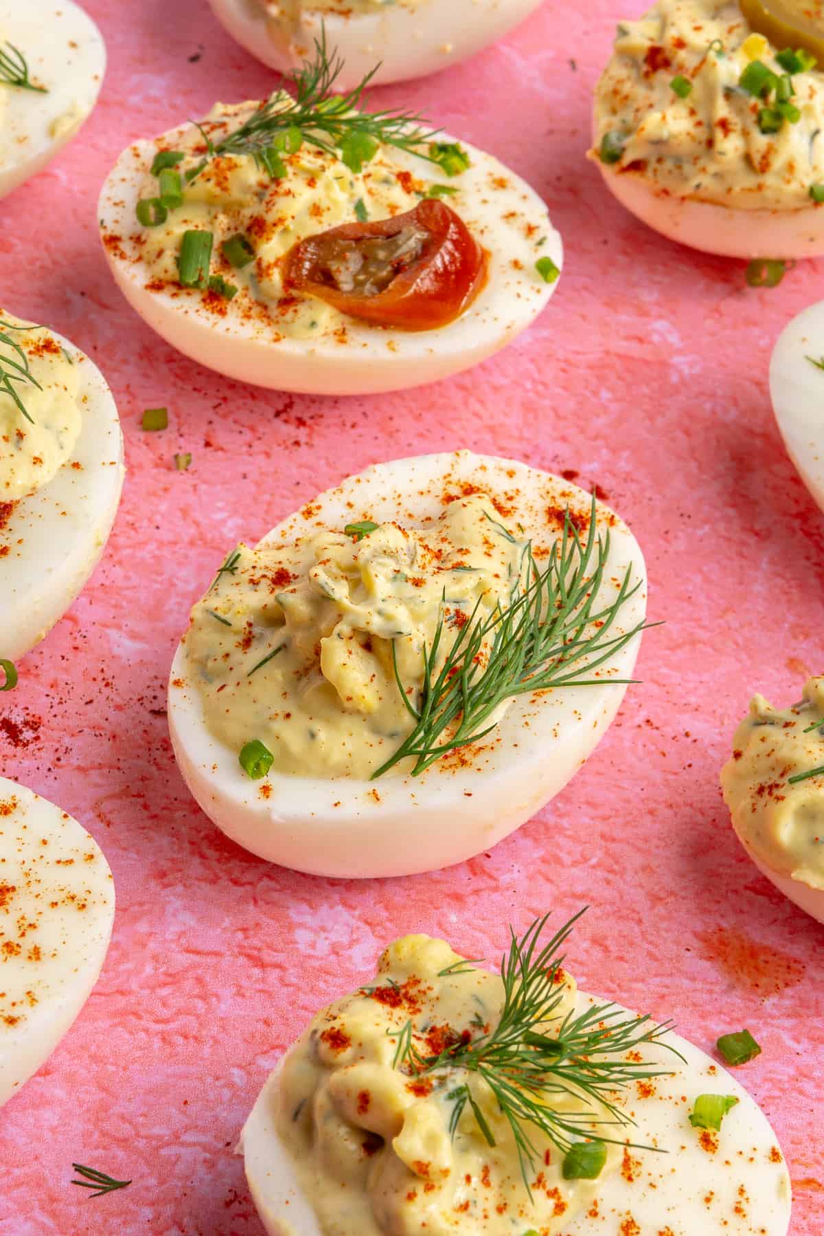 Jalapeño deviled eggs garnished with fresh herbs. 