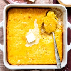White baking dish with cornbread pudding.