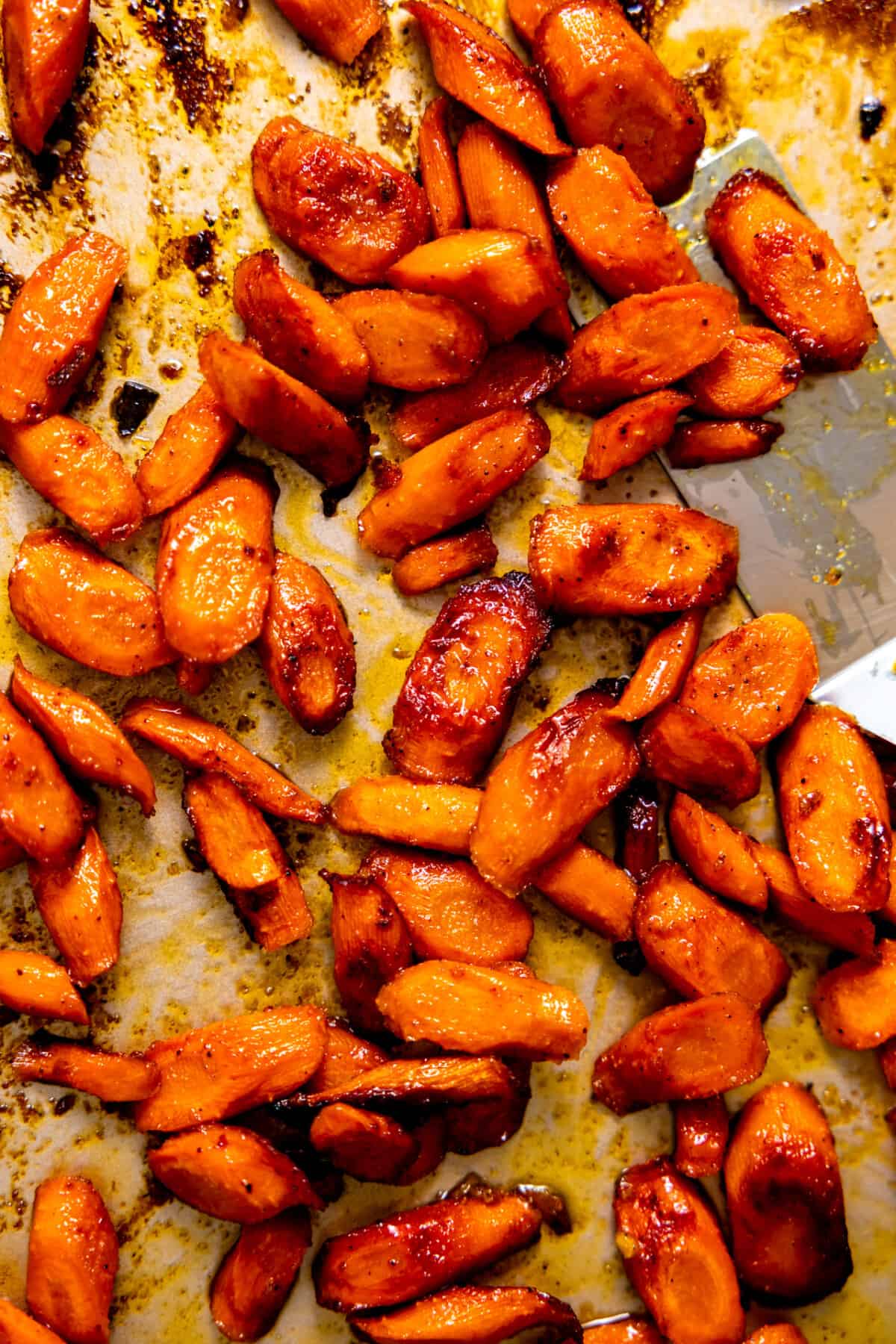 Roasted carrots on a baking sheet.