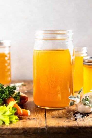 Jar filled with homemade turkey broth.