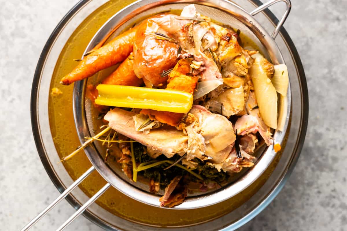 Straining turkey bone broth. 