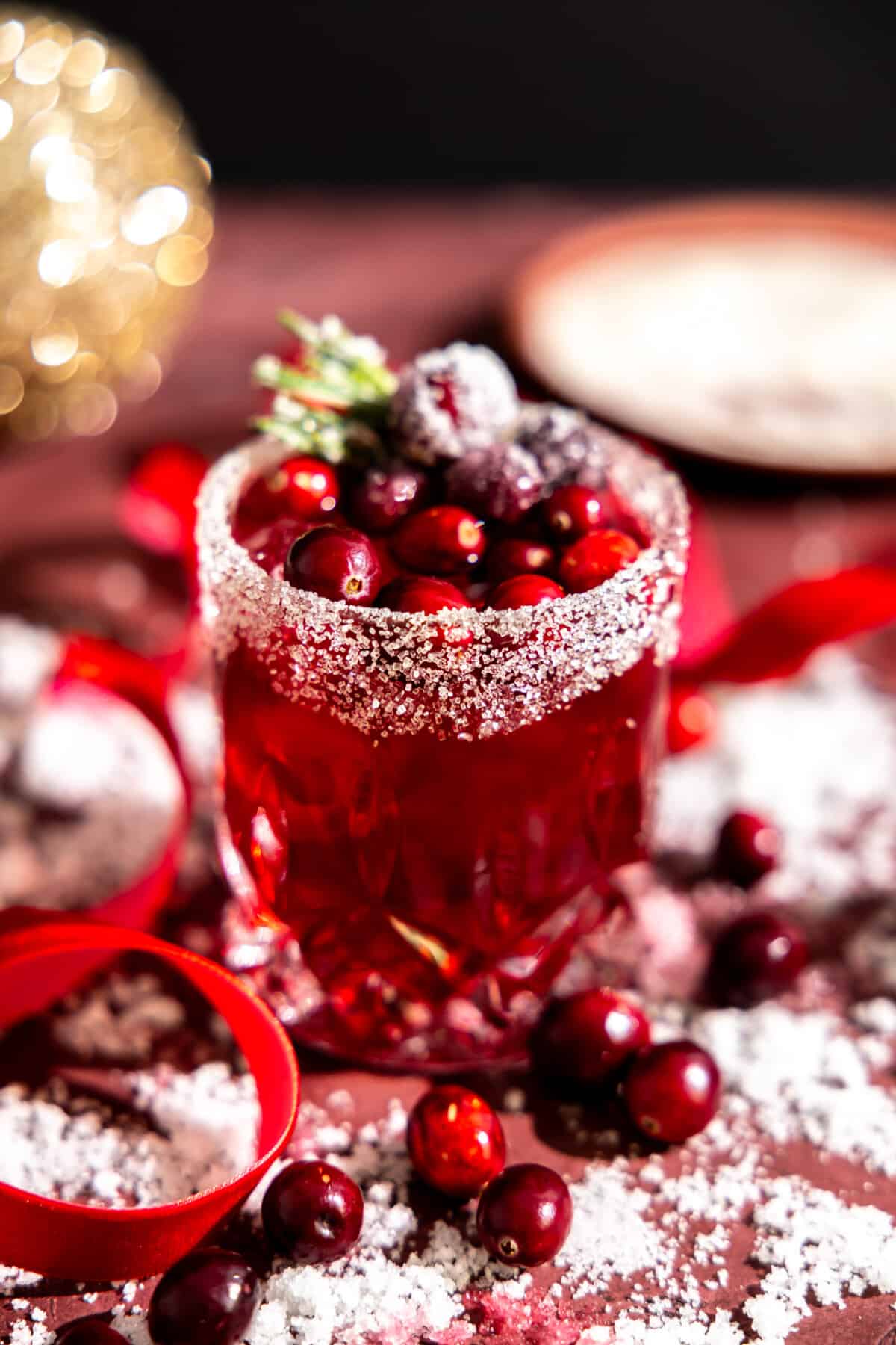 Glass filled with cranberry margarita.