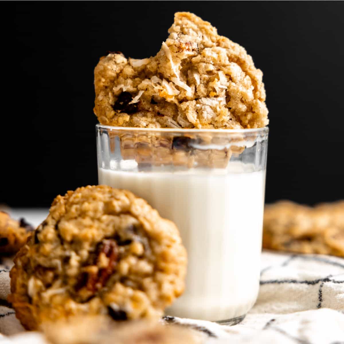Cookie dunked into a glass of milk. 