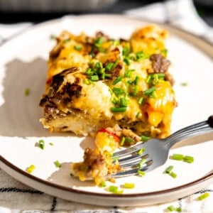 Slice of hashbrown breakfast casserole served on a plate.