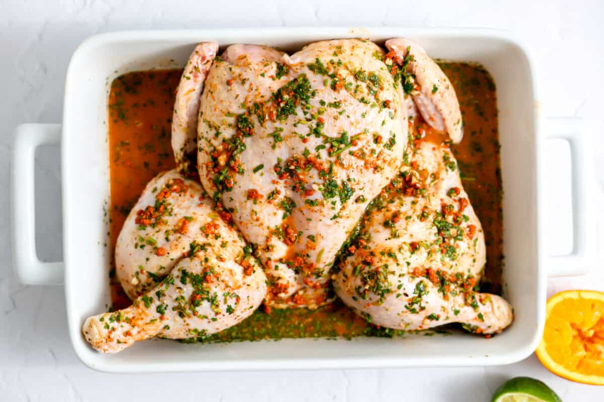 Spatchcocked chicken in pollo asado marinade.