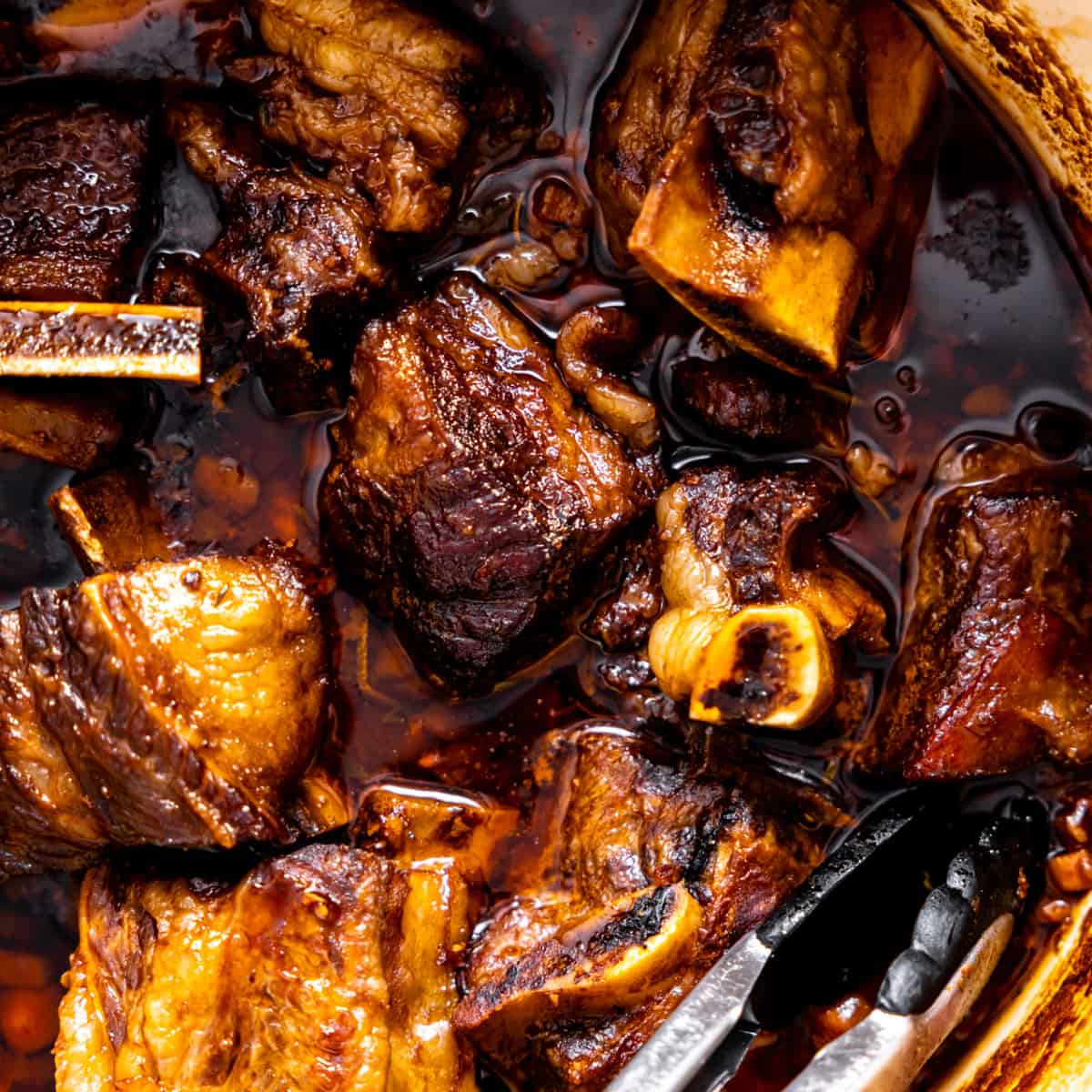 Beef short ribs in a braising pan.
