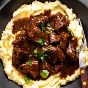 Beef tips and gravy served over mashed potatoes.