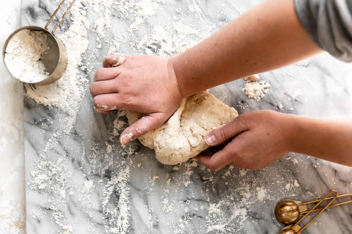 Hand kneading dough.