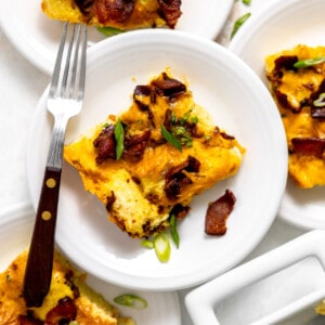 Plates with bacon and cheese strata being served.